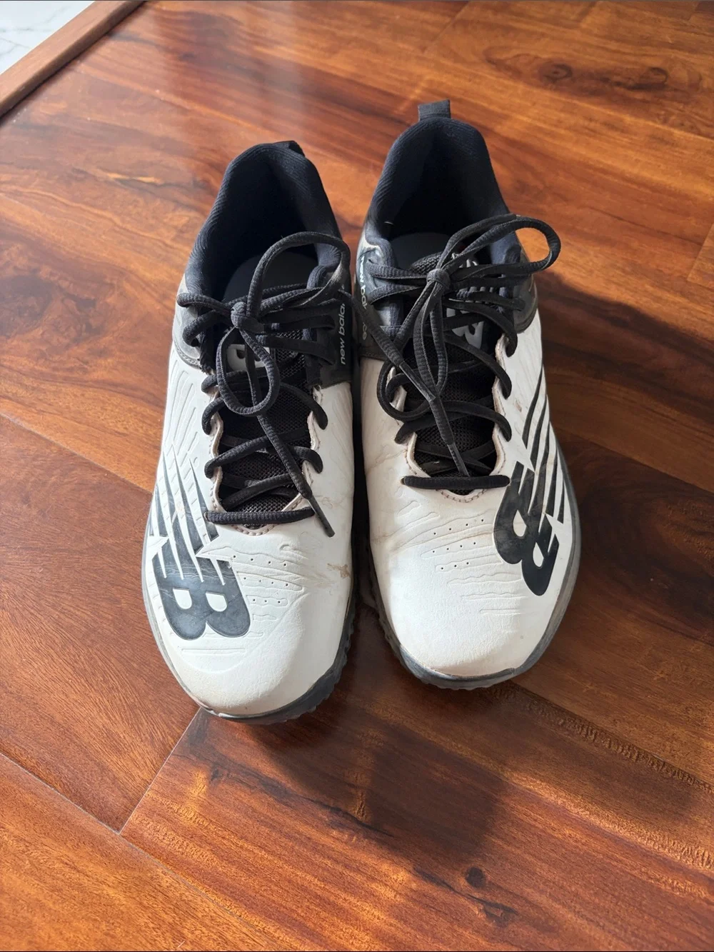 New Balance White and Black Turf Trainers
